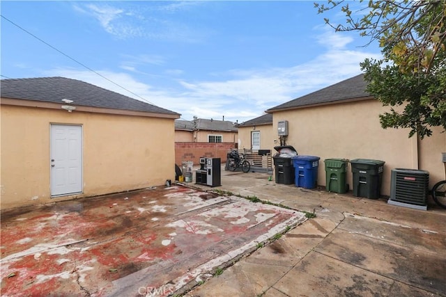 view of patio / terrace featuring fence and central AC