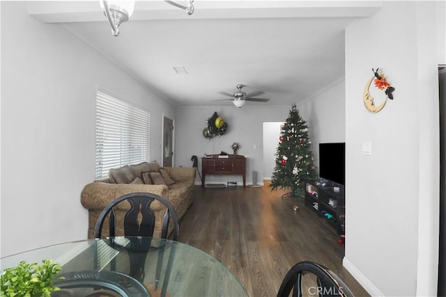 dining area with wood finished floors and ceiling fan