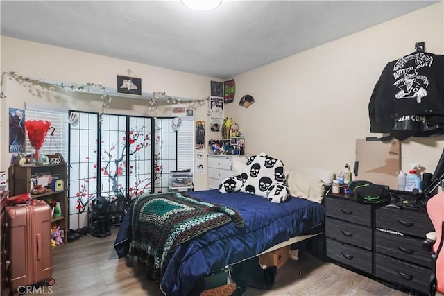 bedroom featuring wood finished floors