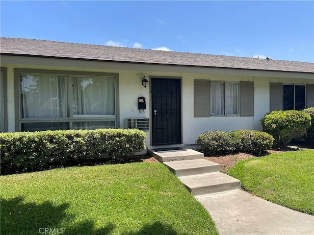 14802 Newport Unit 2B, Tustin, CA 92780 - view of front of property featuring a front lawn and stucco siding