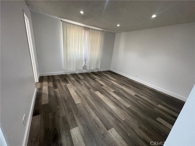 14802 Newport Unit 2B, Tustin, CA 92780 - unfurnished room with recessed lighting and dark wood-type flooring