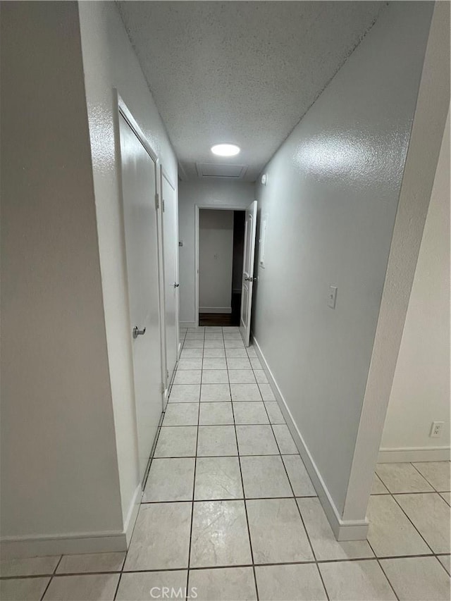 14802 Newport Unit 2B, Tustin, CA 92780 - corridor with light tile patterned floors and a textured ceiling