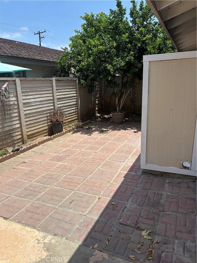 14802 Newport Unit 2B, Tustin, CA 92780 - fenced backyard featuring a patio