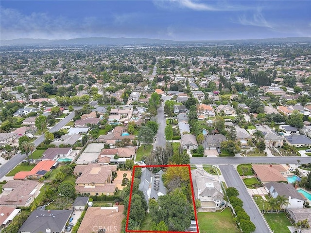 birds eye view of property with a residential view and a mountain view