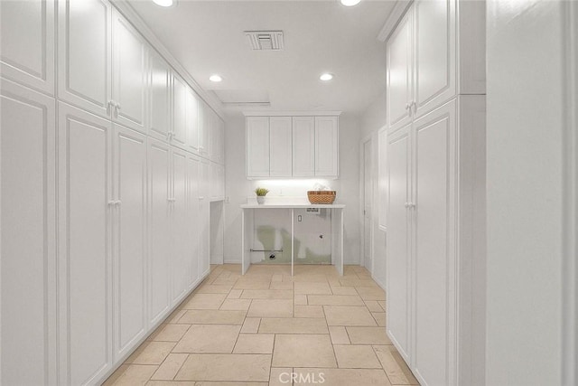 washroom with visible vents and recessed lighting