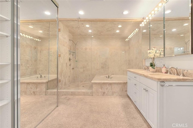 full bath with a garden tub, a sink, double vanity, and a stall shower