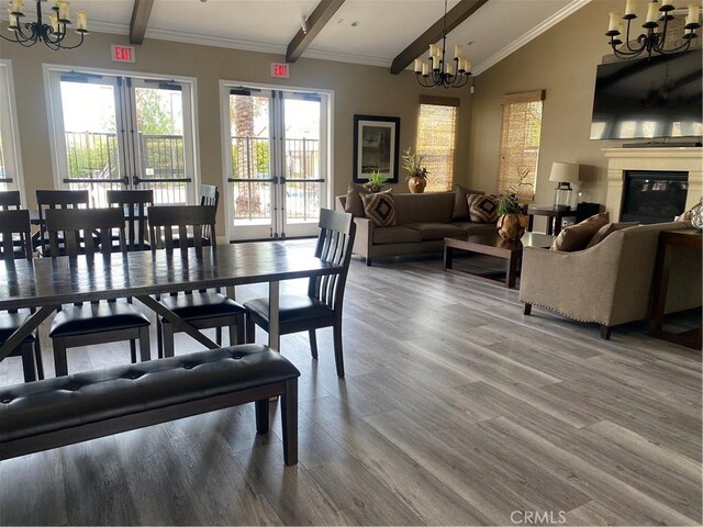 16001 Chase Rd Unit 59, Fontana, CA 92336 - dining room with french doors, lofted ceiling with beams, a chandelier, and wood finished floors