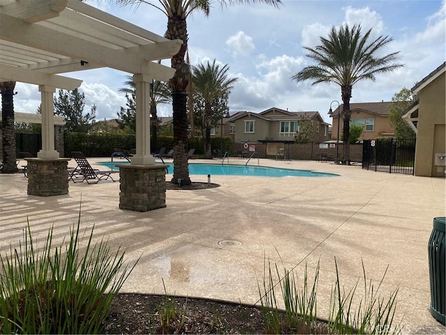 16001 Chase Rd Unit 59, Fontana, CA 92336 - community pool featuring a pergola, a patio area, and fence