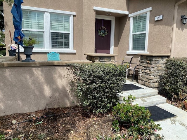 16001 Chase Rd Unit 59, Fontana, CA 92336 - entrance to property featuring stone siding and stucco siding