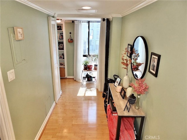 2601 E Ocean Blvd Unit 205, Long Beach, CA 90803 - hallway with ornamental molding, light wood-type flooring, and baseboards