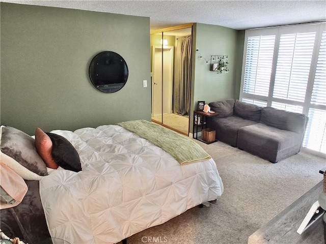 2601 E Ocean Blvd Unit 205, Long Beach, CA 90803 - carpeted bedroom featuring a closet and a textured ceiling