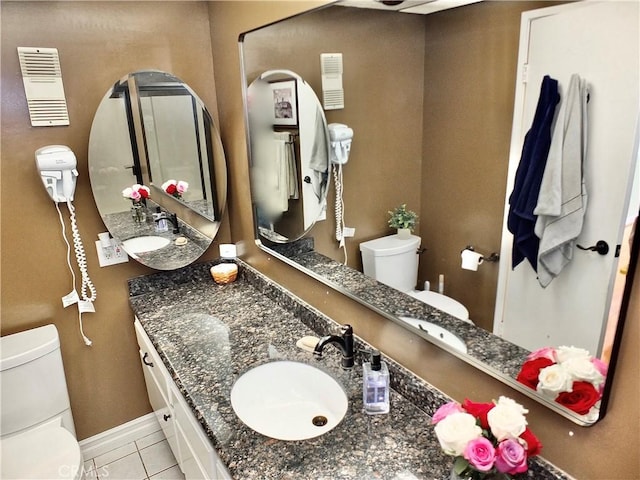 2601 E Ocean Blvd Unit 205, Long Beach, CA 90803 - bathroom with toilet, tile patterned flooring, vanity, and baseboards