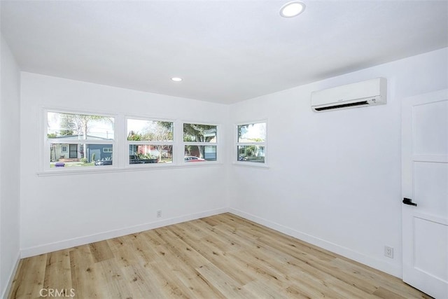 3518 Faust Ave, Long Beach, CA 90808 - unfurnished room featuring a wall mounted AC, light wood finished floors, and recessed lighting