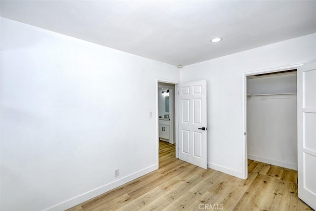 3518 Faust Ave, Long Beach, CA 90808 - unfurnished bedroom with light wood-style flooring, a closet, and recessed lighting