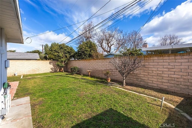 view of yard with a fenced backyard