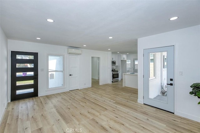 3518 Faust Ave, Long Beach, CA 90808 - foyer featuring an AC wall unit, light wood finished floors, healthy amount of natural light, and recessed lighting