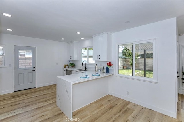 3518 Faust Ave, Long Beach, CA 90808 - kitchen with light wood-type flooring, dishwasher, white cabinetry, a peninsula, and recessed lighting