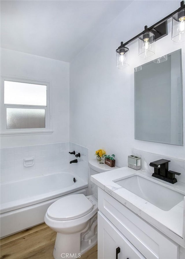 3518 Faust Ave, Long Beach, CA 90808 - full bath featuring vanity, a garden tub, and wood finished floors