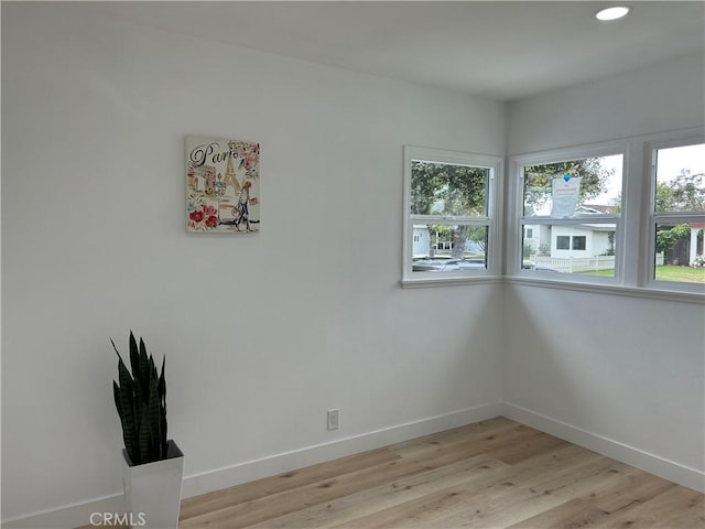 interior space with recessed lighting, baseboards, and light wood-type flooring