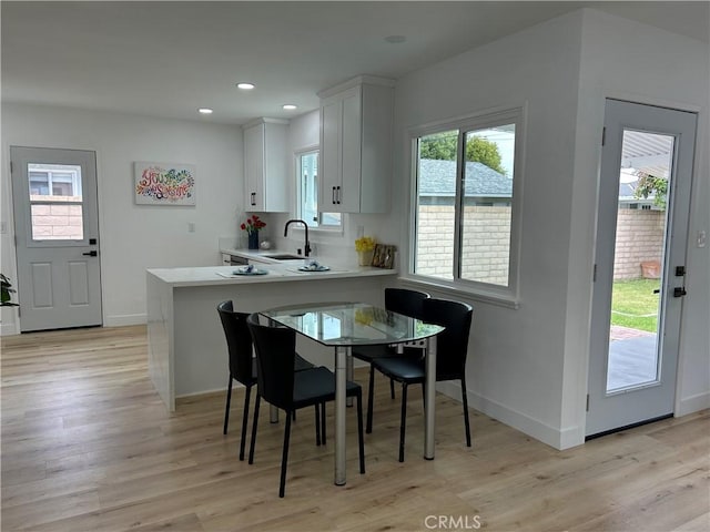 3518 Faust Ave, Long Beach, CA 90808 - dining room with light wood finished floors and recessed lighting