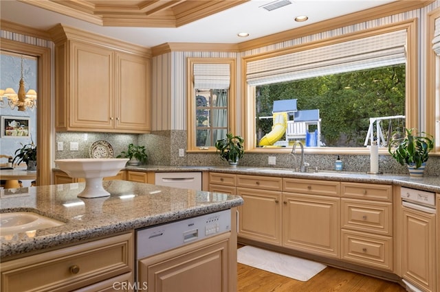 4537 Ellenboro Way, Woodland Hills, CA 91364 - kitchen with a sink, ornamental molding, a raised ceiling, light stone countertops, and light wood finished floors