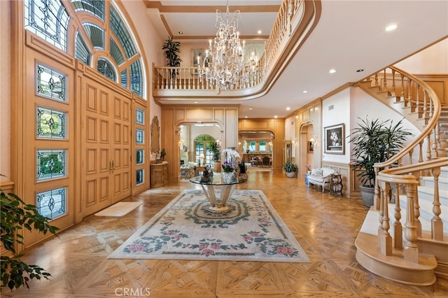 4537 Ellenboro Way, Woodland Hills, CA 91364 - entryway with a towering ceiling, arched walkways, stairway, a chandelier, and ornamental molding