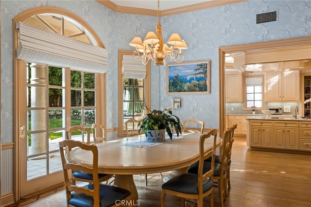 4537 Ellenboro Way, Woodland Hills, CA 91364 - dining area with a chandelier, light wood finished floors, and wallpapered walls
