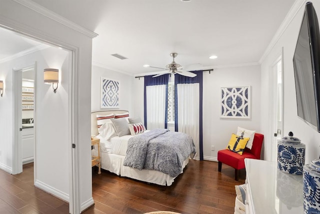 bedroom featuring baseboards, wood finished floors, ceiling fan, and ornamental molding
