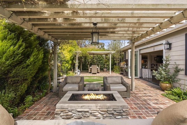 view of patio / terrace featuring a pergola, outdoor dining area, and an outdoor living space with a fire pit
