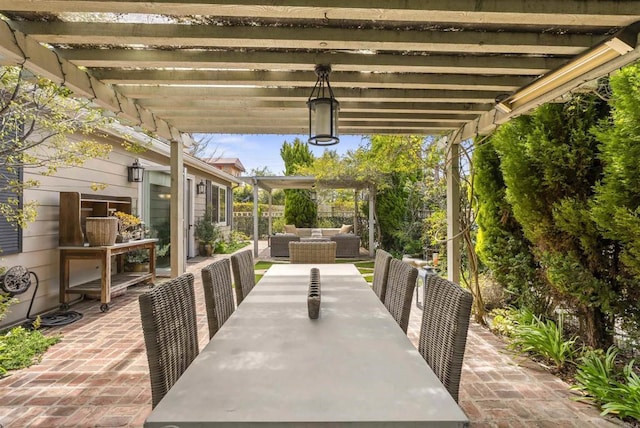 view of patio featuring an outdoor hangout area, a pergola, and outdoor dining space
