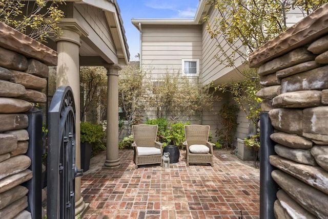 view of patio featuring fence