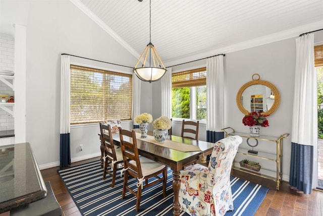 dining room featuring dark wood-type flooring, baseboards, vaulted ceiling, and crown molding