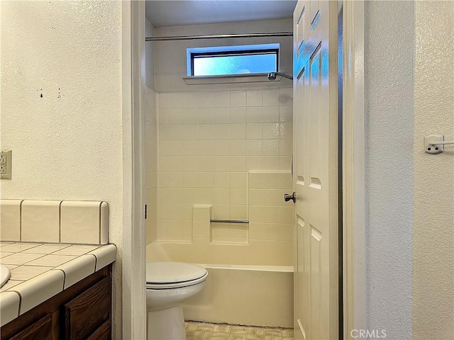 19238 Olive Way, Apple Valley, CA 92308 - full bath featuring a textured wall, toilet, and vanity