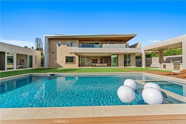 pool featuring a lawn, a grill, an outdoor hangout area, and a patio