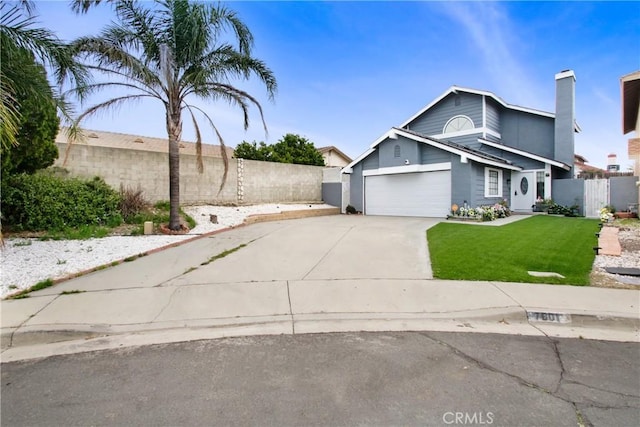 7801 Pinyon Ave, Fontana, CA 92336 - view of front of property with a front yard, an attached garage, fence, and concrete driveway