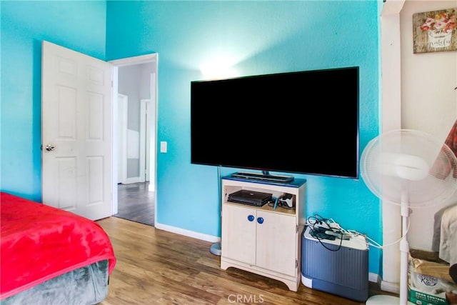 7801 Pinyon Ave, Fontana, CA 92336 - bedroom featuring baseboards and wood finished floors