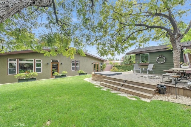 19903 E Rambling Rd, Covina, CA 91724 - rear view of house with a deck, stucco siding, and a yard