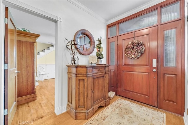 19903 E Rambling Rd, Covina, CA 91724 - entryway with light wood-type flooring, crown molding, baseboards, and stairs