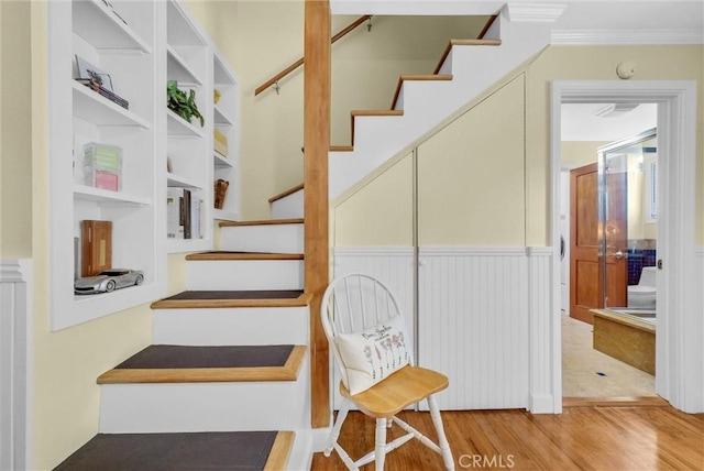 19903 E Rambling Rd, Covina, CA 91724 - stairway with wood finished floors, ornamental molding, and a wainscoted wall