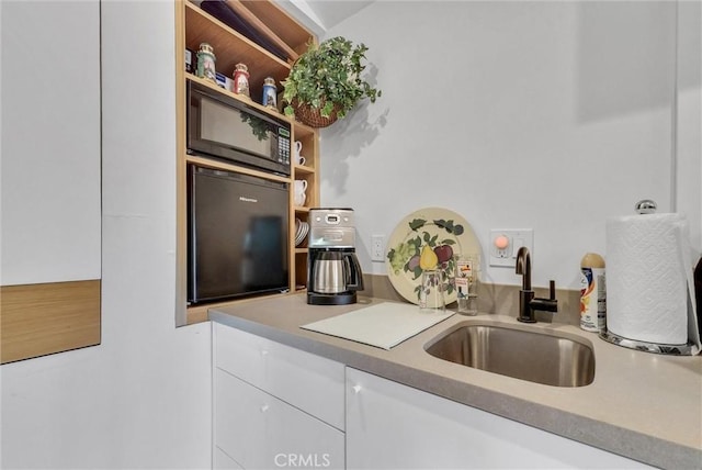 19903 E Rambling Rd, Covina, CA 91724 - kitchen featuring black microwave, a sink, white cabinets, light countertops, and open shelves