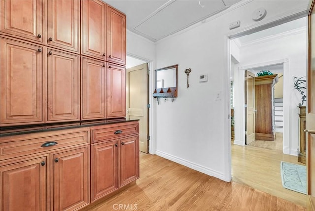 19903 E Rambling Rd, Covina, CA 91724 - hallway featuring light wood finished floors, attic access, crown molding, and baseboards