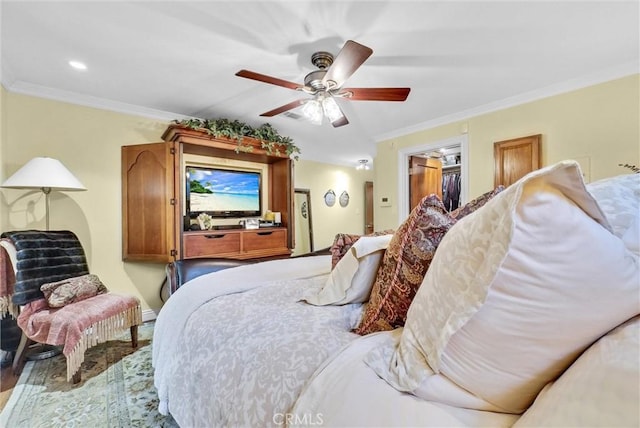 19903 E Rambling Rd, Covina, CA 91724 - bedroom featuring ornamental molding, a ceiling fan, wood finished floors, and a walk in closet