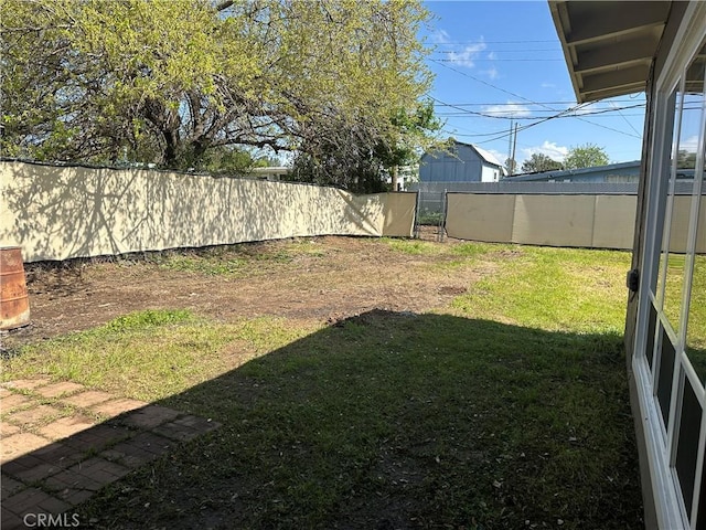 view of yard featuring a fenced backyard
