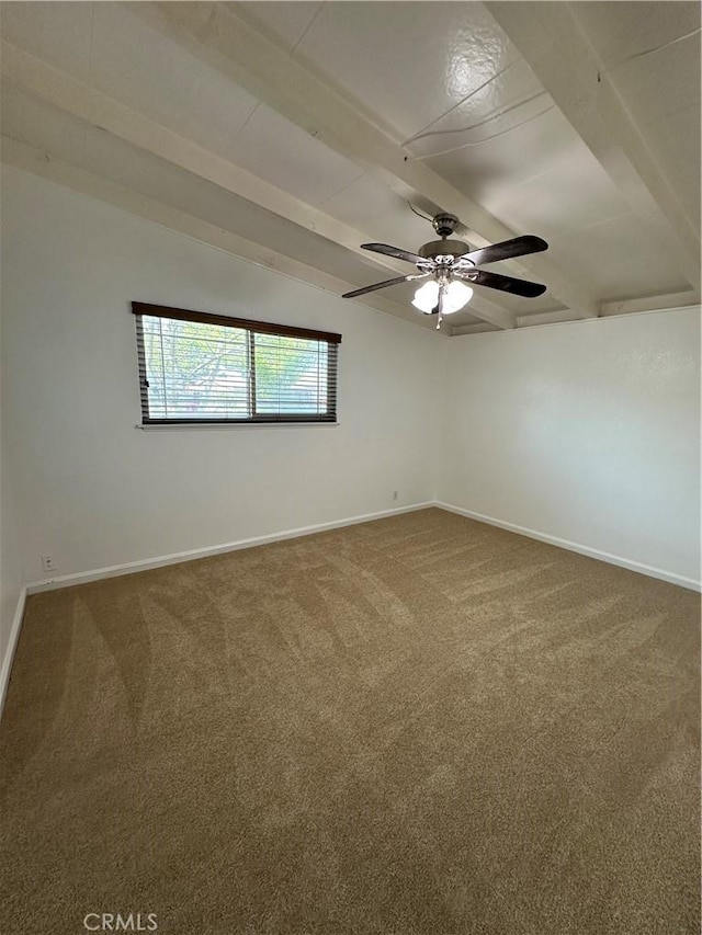 carpeted spare room with baseboards, vaulted ceiling with beams, and ceiling fan