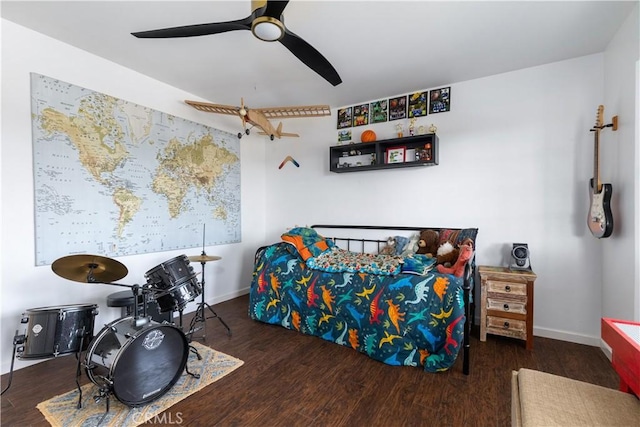 bedroom featuring baseboards, a ceiling fan, and wood finished floors