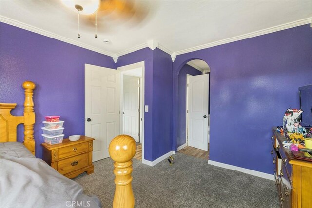 9714 San Benito Ave, Gerber, CA 96035 - bedroom with crown molding, baseboards, arched walkways, and carpet