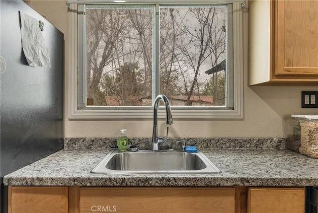 9714 San Benito Ave, Gerber, CA 96035 - room details featuring a textured wall, brown cabinets, and a sink