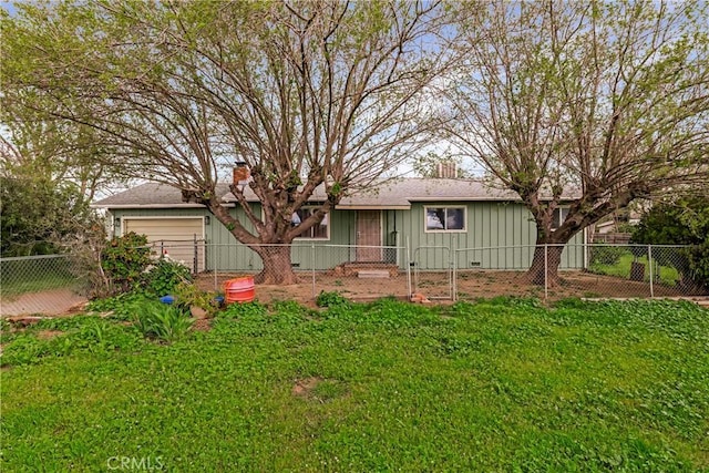 9714 San Benito Ave, Gerber, CA 96035 - view of front of property featuring board and batten siding, a front yard, fence private yard, and a chimney