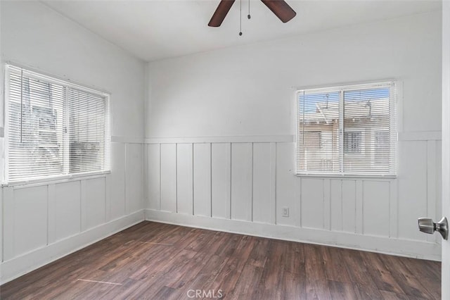 961 W 47th St, Los Angeles, CA 90037 - unfurnished room with ceiling fan, wood finished floors, wainscoting, and a decorative wall