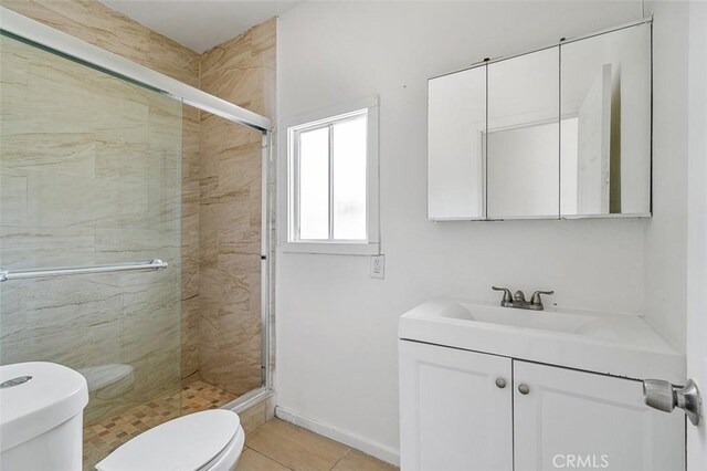 961 W 47th St, Los Angeles, CA 90037 - bathroom with toilet, a shower stall, vanity, and tile patterned floors